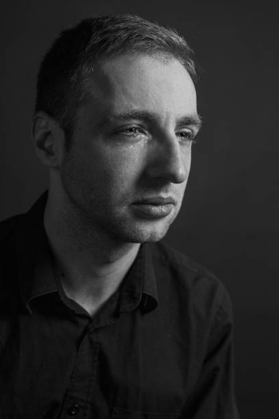 istock Black and White Emotional Portrait Young Man 1217970008