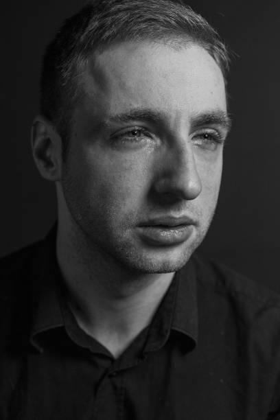 istock Black and White Emotional Portrait Young Man 1217970026