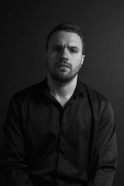 istock Black and White Emotional Portrait Young Man 1217970135