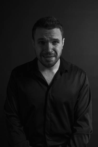 istock Black and White Emotional Portrait Young Man 1217970194