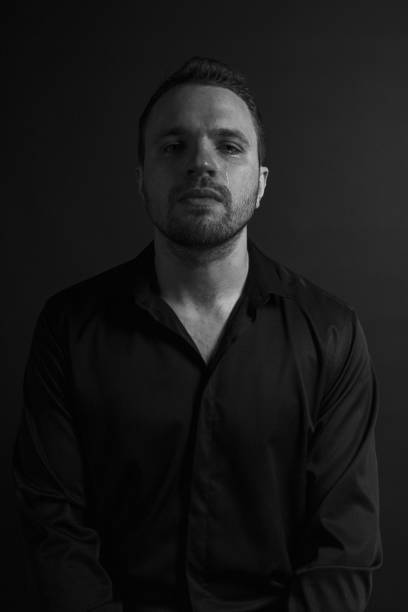 istock Black and White Emotional Portrait Young Man 1217970211