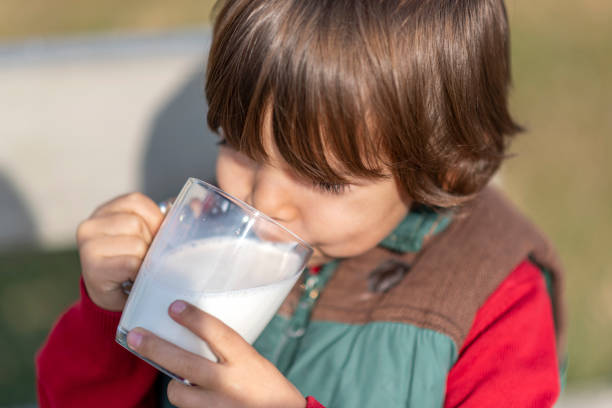 istock Little boy is drinking milk 1217970740