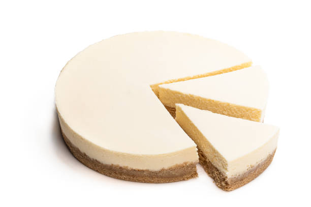 istock Sliced new york style cheesecake isolated on white 1217977360
