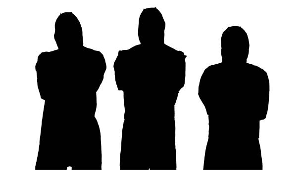istock Silhouette Team of scientists or doctors in protective suits rea 1217977432