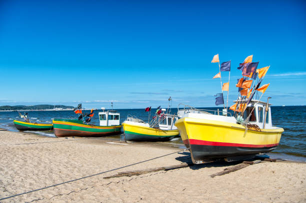 Rewal, Poland – September 02, 2019: Fishing boats on the beach of the Polish Baltic coast near Rewal