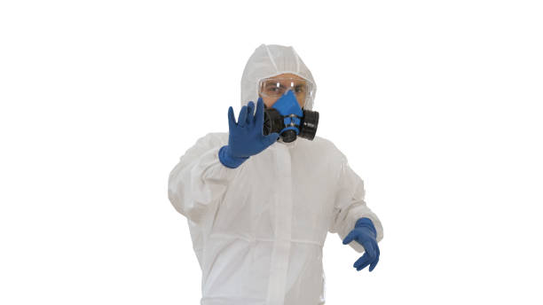 istock The doctor is dancing in a protective suit against the virus on 1217977840