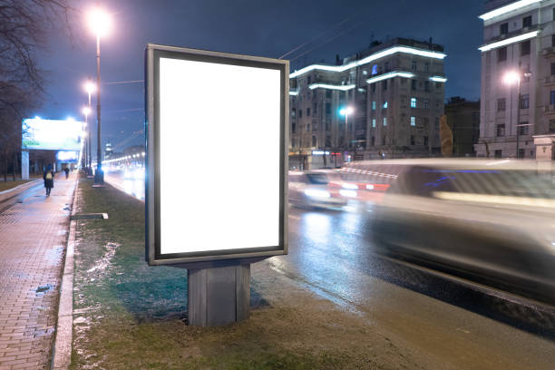 istock vertical billboard on the edge of the road at night 1217982632