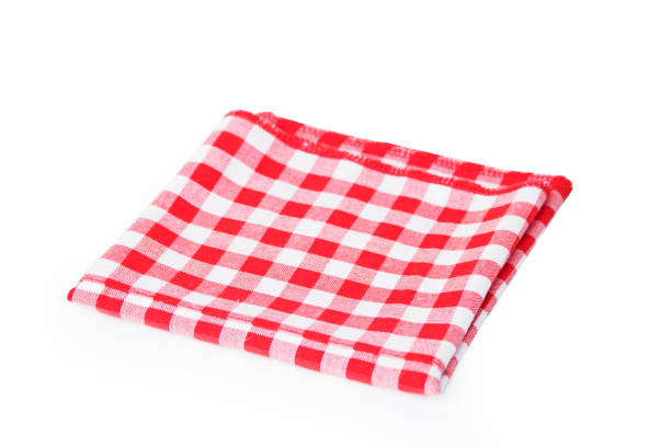 istock Red checkered tablecloth folded in two isolated on white background 1217983489