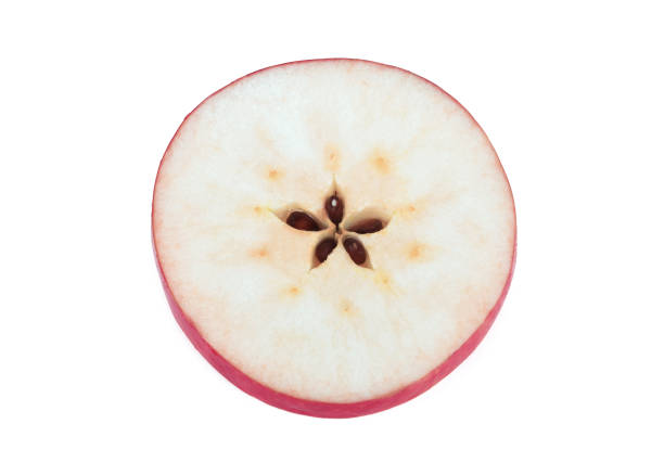 istock red apple slice isolated on the white background 1217986557