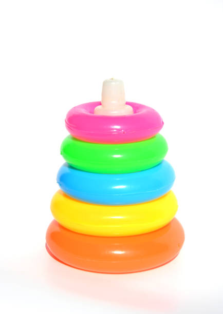 Pyramid build from colored plastic rings. Toy for babies to joyfully learn mechanical skills and colors.