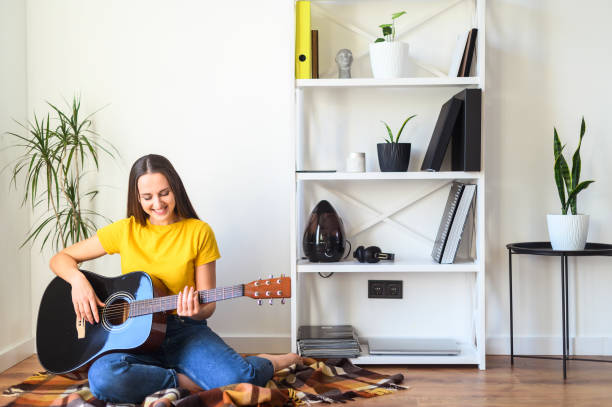 istock A woman with a guitar spends leisure 1217987501