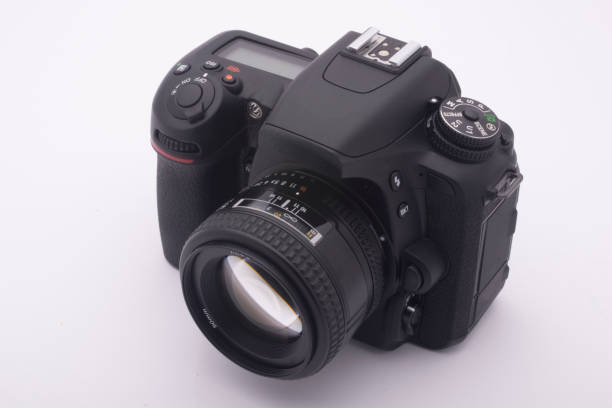 istock black SLR camera on a white background 1217988810