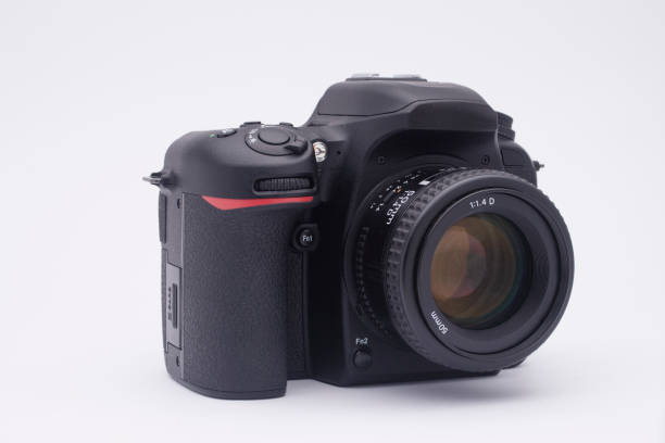 istock black SLR camera on a white background 1217988816