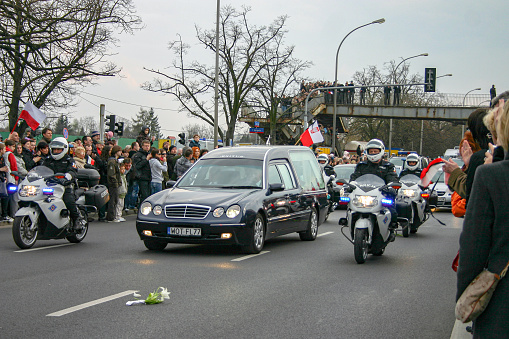 Warsaw, Poland - 11 April, 2010: Hearse carrying coffin with body of president Lech Kaczynski. The President was transport from the airport.