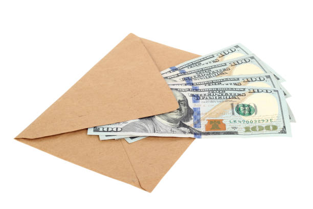 istock 100 US dollar bills in an envelope isolated on white background 1217990277