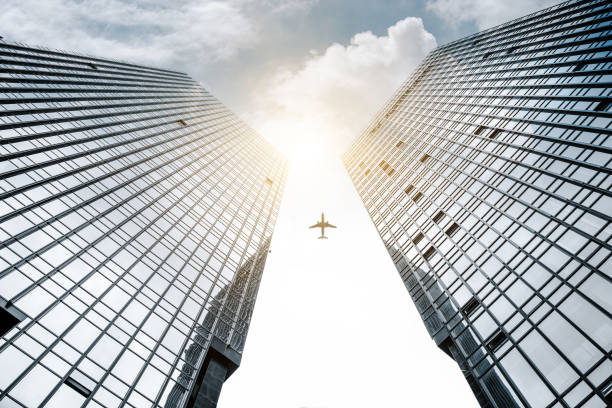 istock The plane flew through two symmetrical city buildings 1217990494