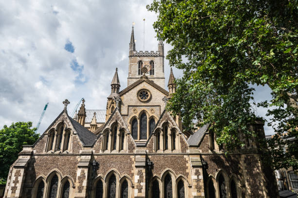 Southwark Cathedral in London Low-angle view of the Southwark Cathedral on the South Bank of the River Thames in London. southwark stock pictures, royalty-free photos & images