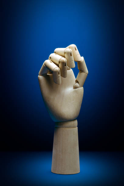 istock Artificial intelligence wooden hand front view with closed fingers 1217993860