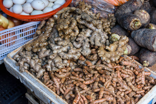 Turmeric and ginger for sale at a market stall