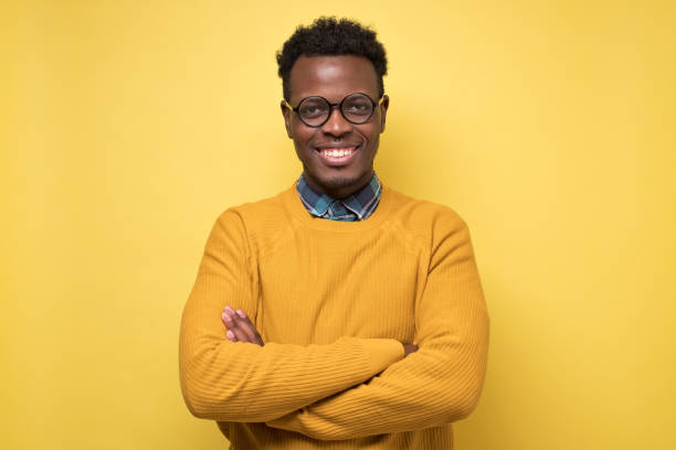 istock Smiling young african american man with glasses smiling confident 1217994868