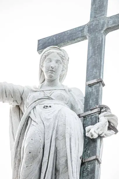 Photo of Saint Maria with cross and holy grail at the roof of Church of San Giorgio Maggiore in Venice isolated at white background, Italy, summer, direct light