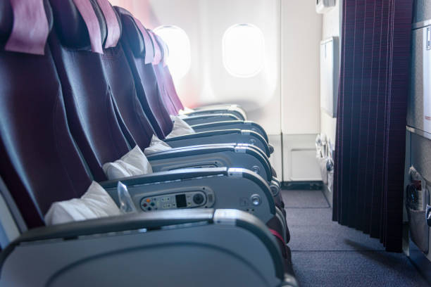 istock Row of empty seats on an aeroplane 1217997148