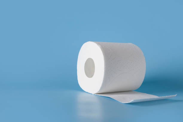 istock Roll of soft toilet paper on blue. Increased potential. High unexpected demand. Deficit. 1217997155