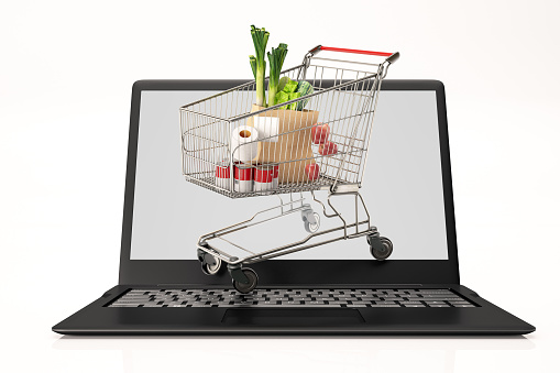 Online Internet Shopping with Laptop and Market Trolley. 3d render