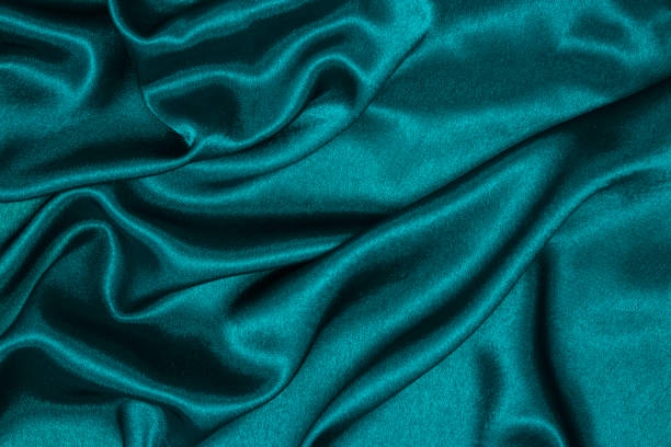 istock Smooth elegant blue silk or satin luxury cloth texture can use as abstract background. 1217999511