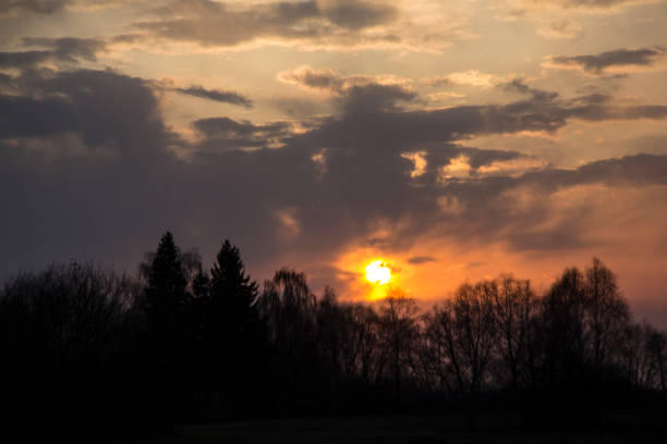 Clouds, as if, do not allow the Sun to give light and warmth to people.