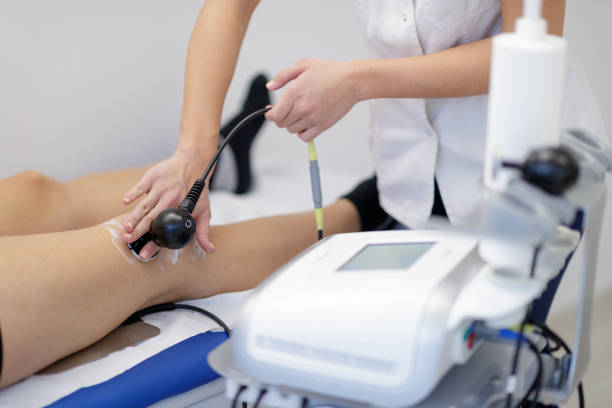 istock Applying Tecar therapy on patient's knee 1218007558
