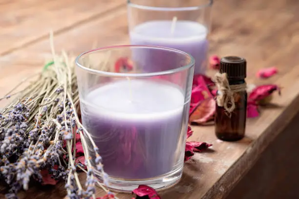 Dry lavender flowers and candle lavender color. Aromatherapy
