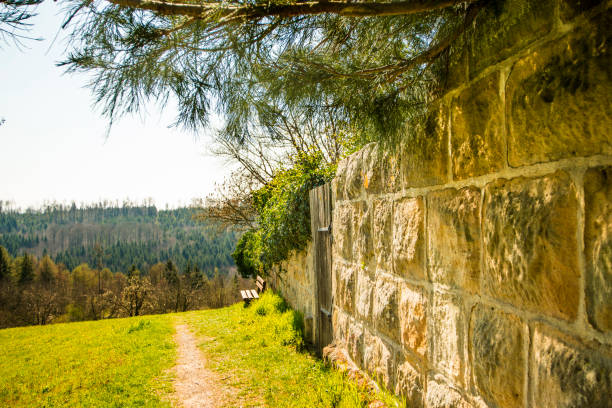 park bench at an old antique abbey wall