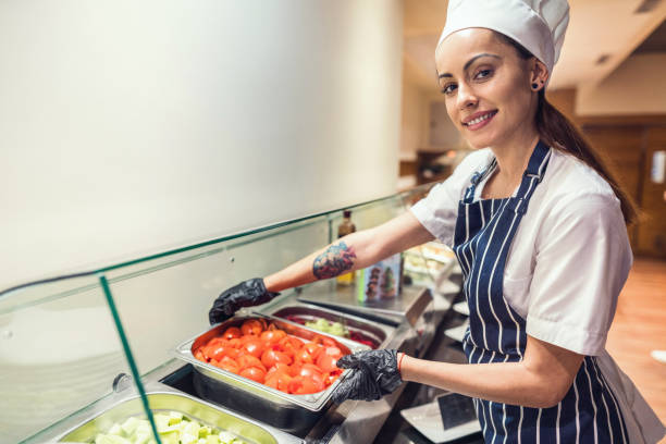 istock Female cook serving fresh appetizers in the restaurant 1218010292