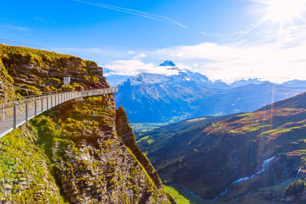 Cliff Walk in Grindelwald First, Switzerland Grindelwald, Switzerland landmark sky cliff walk metal bridge at First peak of Swiss Alps mountain, snow peaks panorama, Bernese Oberland, Europe Grindlewald stock pictures, royalty-free photos & images