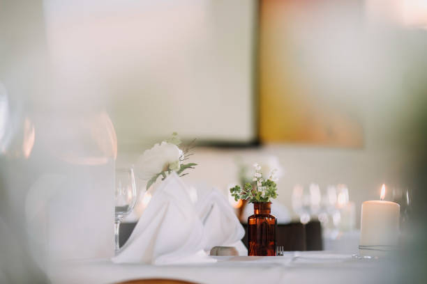 istock wedding decoration on tables with pharmacy glasses and candles 1218011569