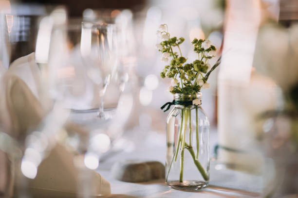 istock wedding decoration on tables with pharmacy glasses and candles 1218011597
