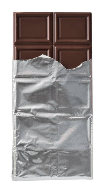 istock Dark chocolate bar in silver foil packaging top view isolated 1218013045