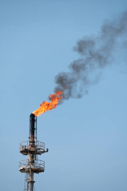 istock Smoke from Oil refinery at sunrise. environment pollution crisis concept. 1218015215