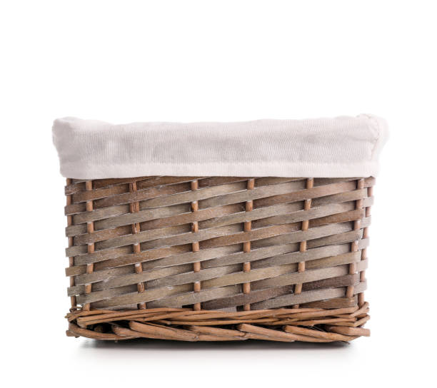 istock Nice straw basket for laundry isolated on white background 1218017110
