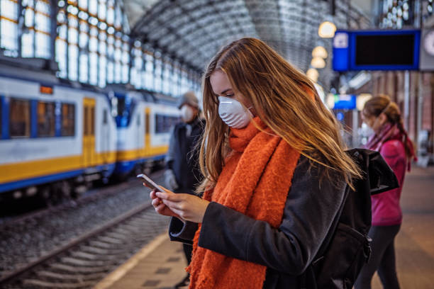 istock Female commuter using public transport during virus outbreak 1218017224