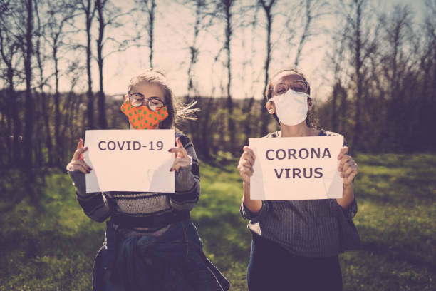istock Women In The Nature Wearing Protective Face Masks 1218017539