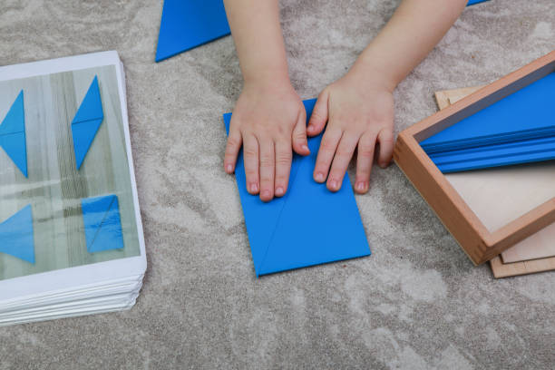 istock Montessori material for folding various shapes from triangles 1218020006