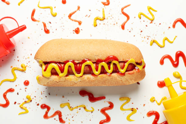 istock Hot dog and sauces on white background, top view 1218020182