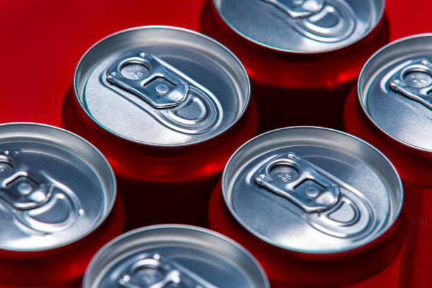 istock Set of aluminum cans on red background, top view 1218024889