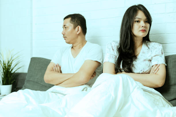 istock Frustrated sad a husband sit on bed think of relationship problems 1218025013