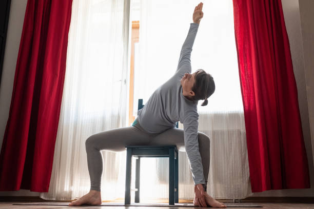 istock Caucasian girl workout doing twisted Goddess Pose 1218026496