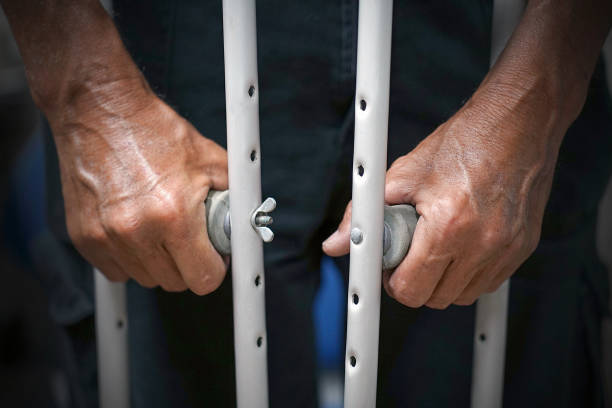 istock Man with crutch. Close-up. Side view 1218027680