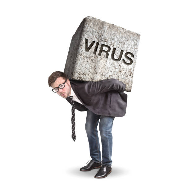 istock Man carrying a heavy stone labeled with VIRUS 1218027842