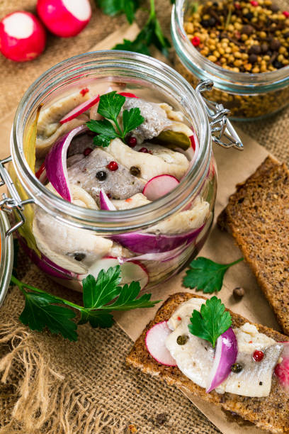istock Pickled Marinated Herring with Spices, Radish and Red onion 1218028702